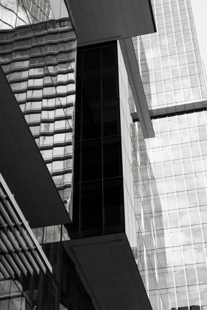 istock Closeup black and white modern office building with reflection, skyscraper, abstract background with copy space 2187367544