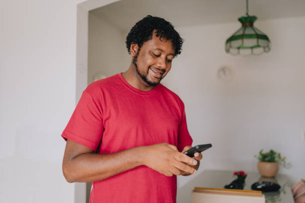 istock Man typing messages on smartphone at home 2187367605