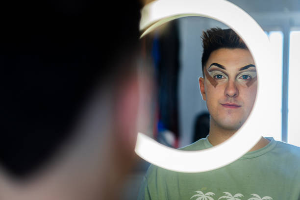 Intimate portrait of contemplative eyes, highlighted by a spectrum of light reflections
