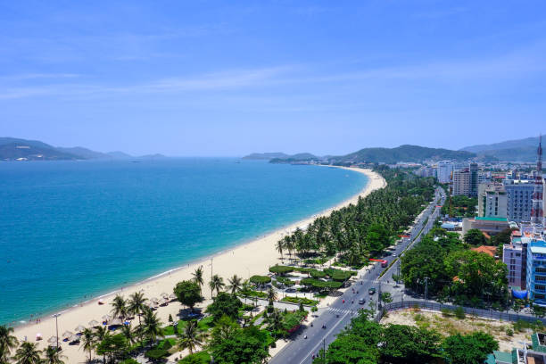 istock a beach with a view of a city and a blue sky 2187380123