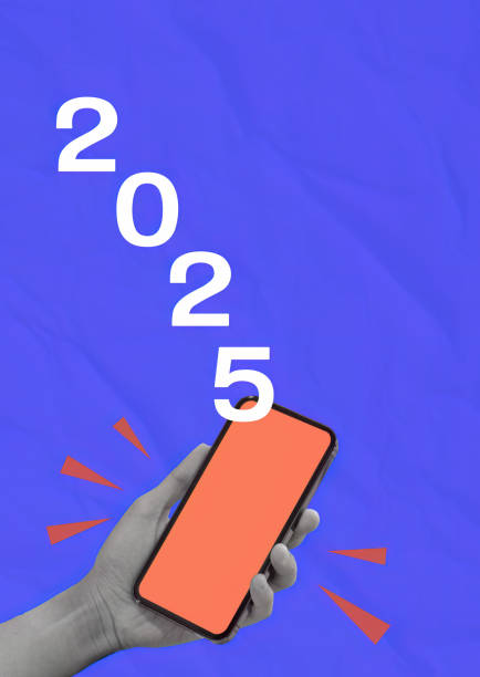 istock 2025 Vision Represented by Smartphone in Hand against Blue Backdrop 2187381618