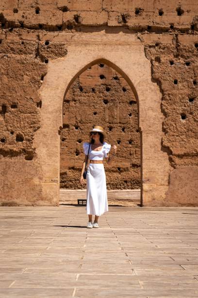 istock Woman in white at ancient archway in Marrakesh 2187382346