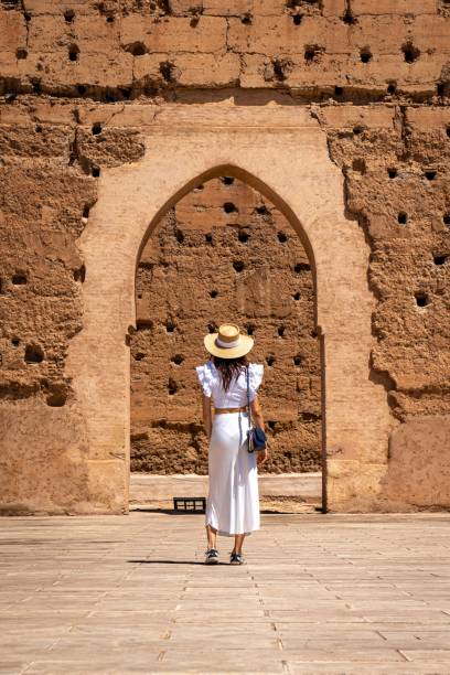 istock Woman in white before ancient archway 2187382456