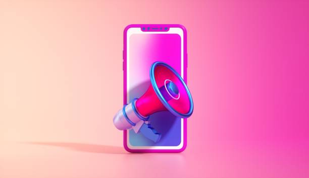 istock Smartphone and megaphone on a vibrant pink background with gradient lighting. Digital marketing concept, minimalist design, bold colors - 3D render. 2187383939