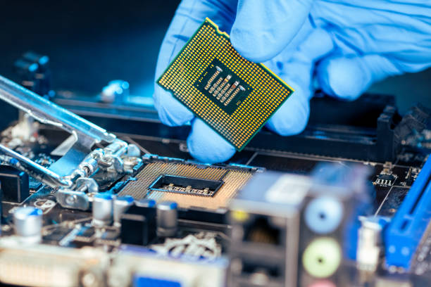istock A detailed image of a CPU installed on a computer motherboard, surrounded by capacitors and circuits. 2187387085