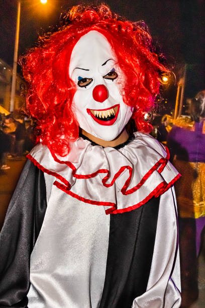 A stock photo of a creepy evil vampire clown against a dark textured background.\n[url=http://www.istockphoto.com/search/lightbox/10593020#1071a130][IMG]http://www.bellaorastudios.com/banners/new01.jpg[/IMG][/url]