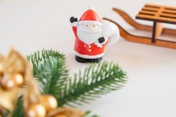 istock Sanda Claus doll and fir tree leaves 2187390636