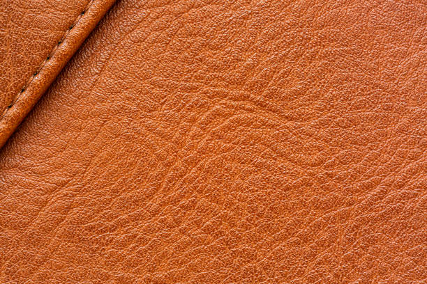 istock Brown macro synthetic leather texture,Seamless brown leather texture background surface closeup,patterned fabric with brown synthetic leather with a smooth, shiny texture 2187393900