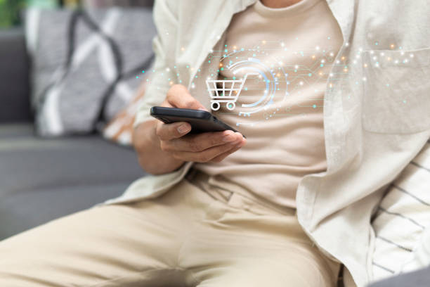 istock using smartphone with application online shopping platform and shopping cart icon during sitting at home 2187396511