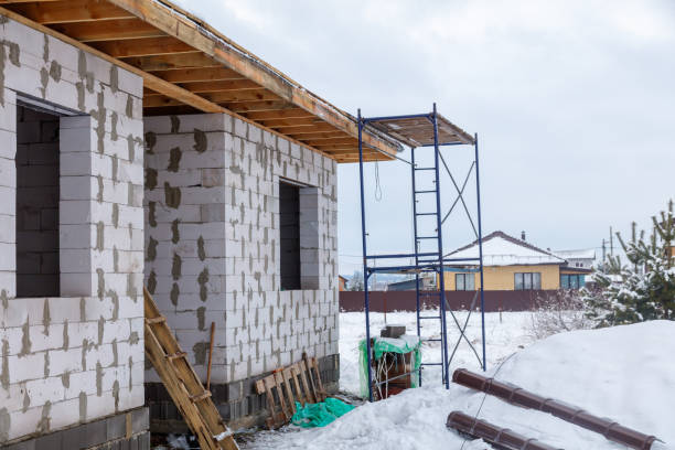 istock A house under construction with scaffolding on the roof 2187400143