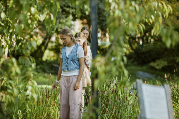 istock Girls Walking Along Botanical Garden 2187400598