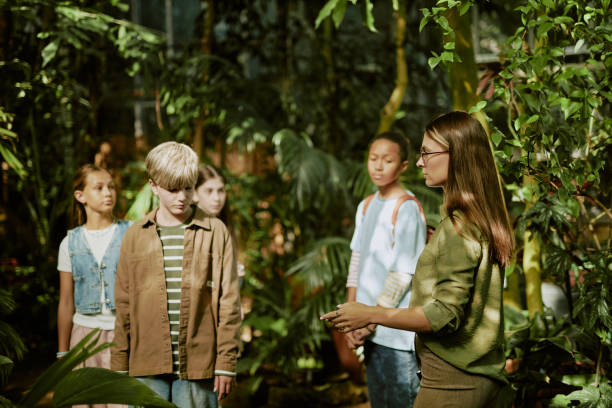 istock Tour Guide And Kids In Greenhouse 2187400709