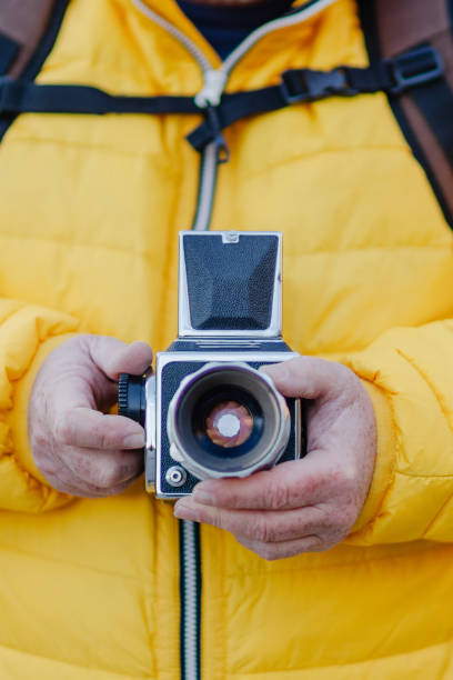 istock Close-up of a photographer holding a medium format camera 2187401267