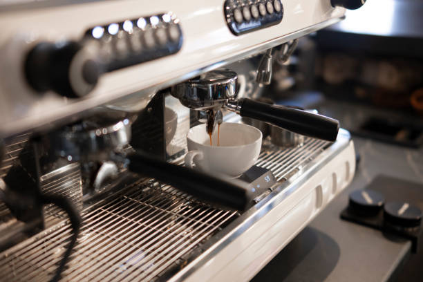 istock Preparing Fresh Americano With a Modern Espresso Machine in a Cafe Setting 2187401713