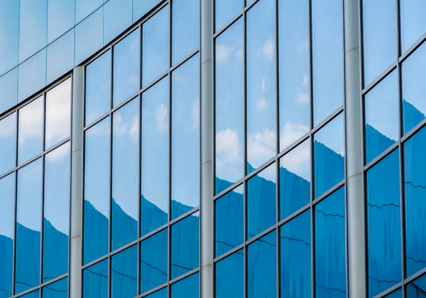 abstract background reflected in the glass windows of the building