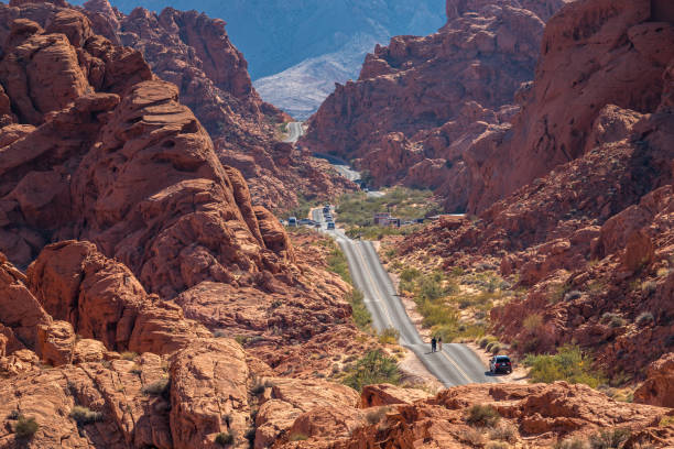 Mouse's Tank Road winds through the vibrant red sandstone formations of Valley of Fire State Park, Nevada.