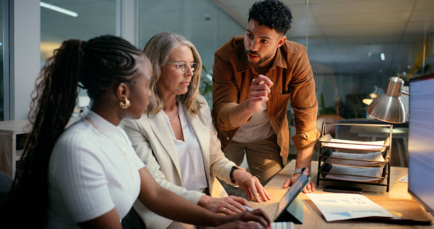 istock Business, people and meeting at office on computer with teamwork and collaboration as copywriter. Employees, coworking and planning with ceo or boss for strategy,  proposal and creative project 2187408455