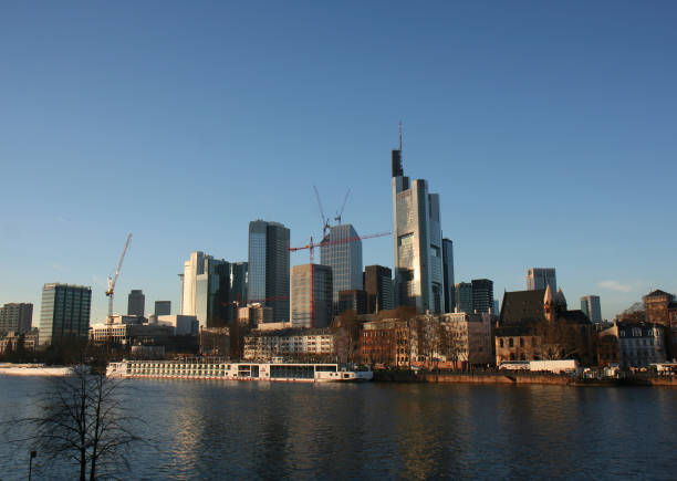 Frankfurt, Germany-December 15,2013:Frankfurt Skyline, Tour Boat and People standing by The River