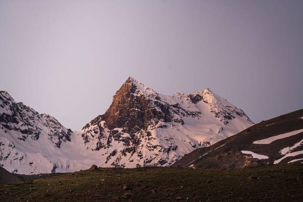 istock Snow-capped mountain peaks at dusk 2187412228