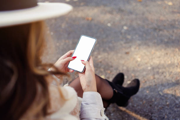 istock An unrecognizable woman using smart phone outdoors 2187417371
