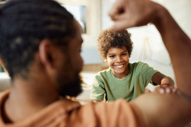 istock Let me see how strong you are daddy! 2187421247