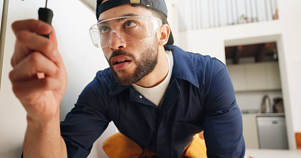 istock Plumber, man and screwdriver for pipe in kitchen with home maintenance and fixing leak by sink with glasses. Plumbing contractor, handyman and tools for filter system installation for small business 2187421661