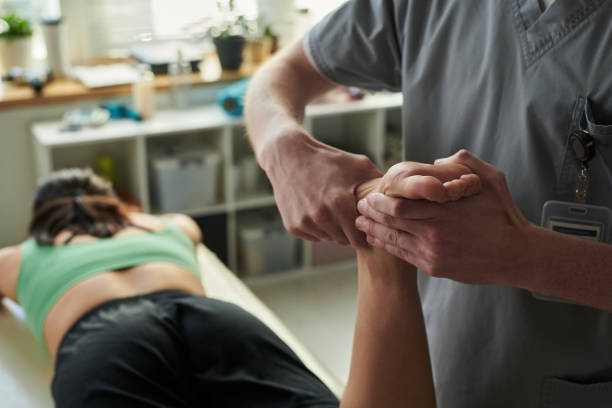 istock Massage Therapist Treating Client in Wellness Center 2187422143