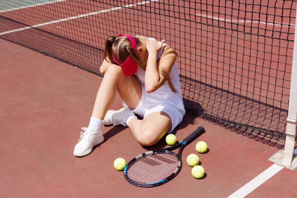 istock a young tennis player was injured while playing tennis 2187422694