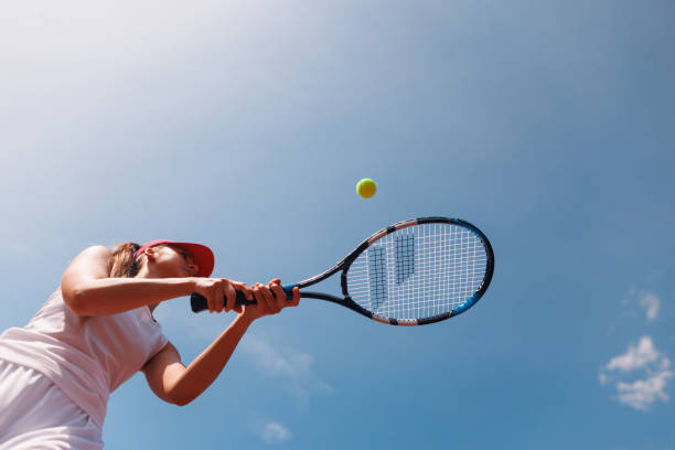 istock young tennis player playing tennis, bottom view 2187422716