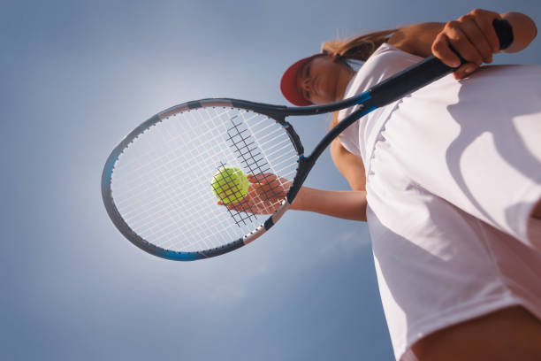 istock young tennis player playing tennis, bottom view 2187422718