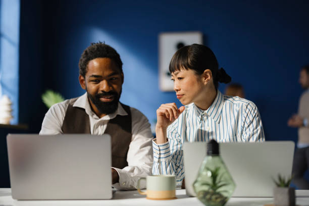 istock Diverse entrepreneurs reading an e-mail on a computer in the office. 2187423394