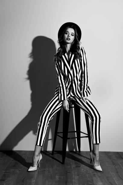 istock Vertical full-size full-length front view portrait of attractive charming well-dressed flirty coquettish lovely gorgeous emancipated dreamy lady posing on chair isolated on gray background 2187423839