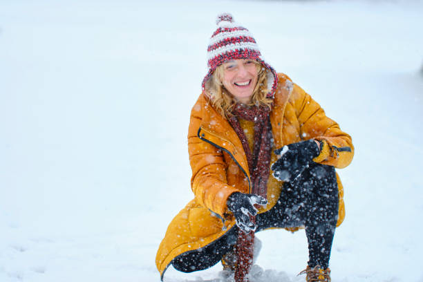 Caucasian young woman enjoying snow outdoor in winter time. Navarre, Spain, Europe.