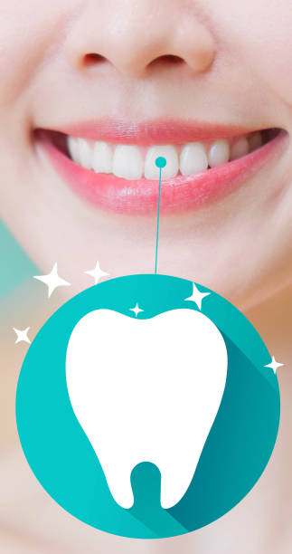advertising blank copyspace with cute tooth design - closeup asian woman smiling white teeth clean healthy attractive look