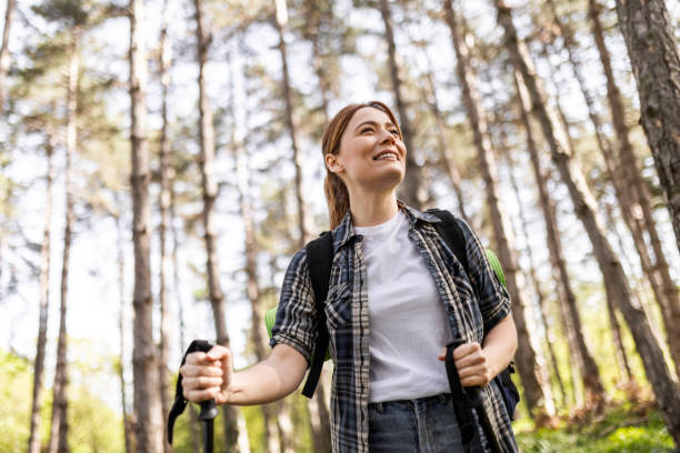 istock Young Woman Hiking with Poles 2187427741