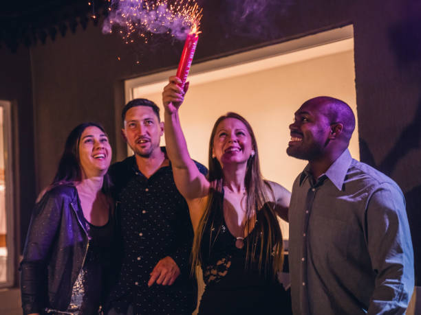 istock Friends Celebrating with Sparklers at Night Gathering 2187430763