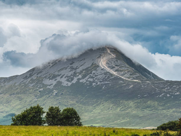 Majestic Mountain Peak Croagh Patrick Shrouded in Clouds Under Dramatic Sky Landscape, Ireland