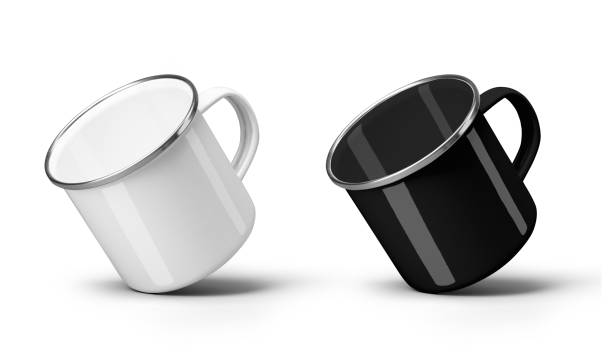 istock Mockup of white, black enamel mug with silver border, diagonal presentation, for design. Set 2187439433