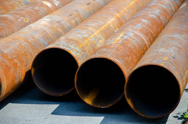 istock Large metal pipes on the road 2187443807