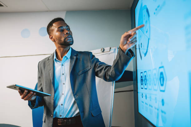 istock Businessman presenting results on TV 2187445706