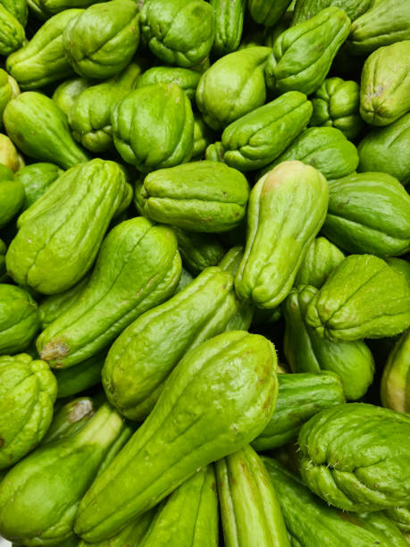 istock Fresh Chayote Background - Vibrant Green Vegetables 2187447709