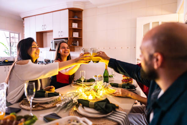 istock Family toasting during christmas dinner at home 2187448050