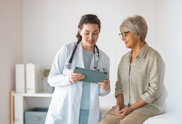 istock patient with a doctor in medical office 2187449304