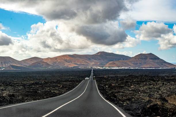 istock Scenic road through volcanic landscape in Lanzarote. 2187450159