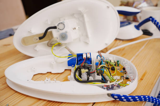 istock repair of a steam iron. 2187451356