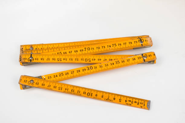 istock old yellow wooden meter on white background 2187452294