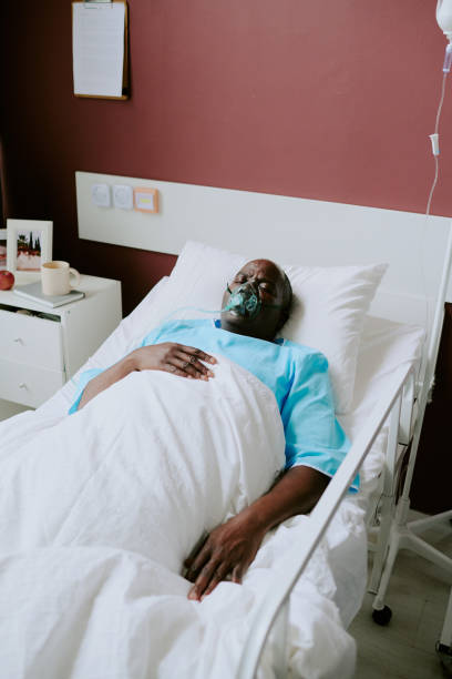 istock Sleeping African American Patient in Hospital Bed Resting 2187453759