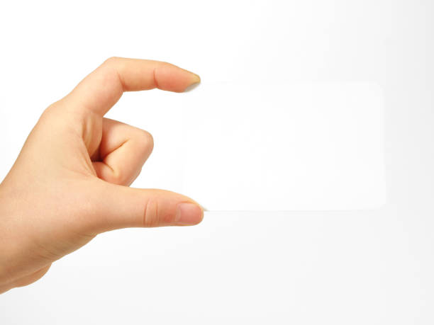 istock Children Hand holding a white Paper over white Background 2187454412