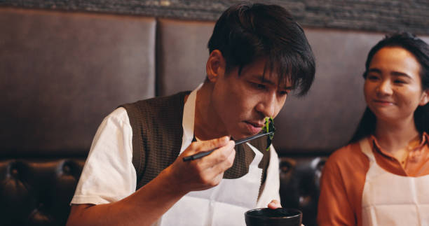 istock Cooking, smell and bowl with Japanese man in restaurant for dinner course, gourmet and learning recipe. Ingredients, culture and food aroma with asian people in class for nutrition, menu or meal prep 2187455308