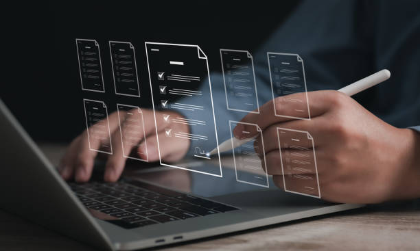 istock Performance checklist concept : businessman using stylus pen with laptop for questionnaire, evaluation, assessment online or survey exam and filling out for digital survey and checklist. 2187455836